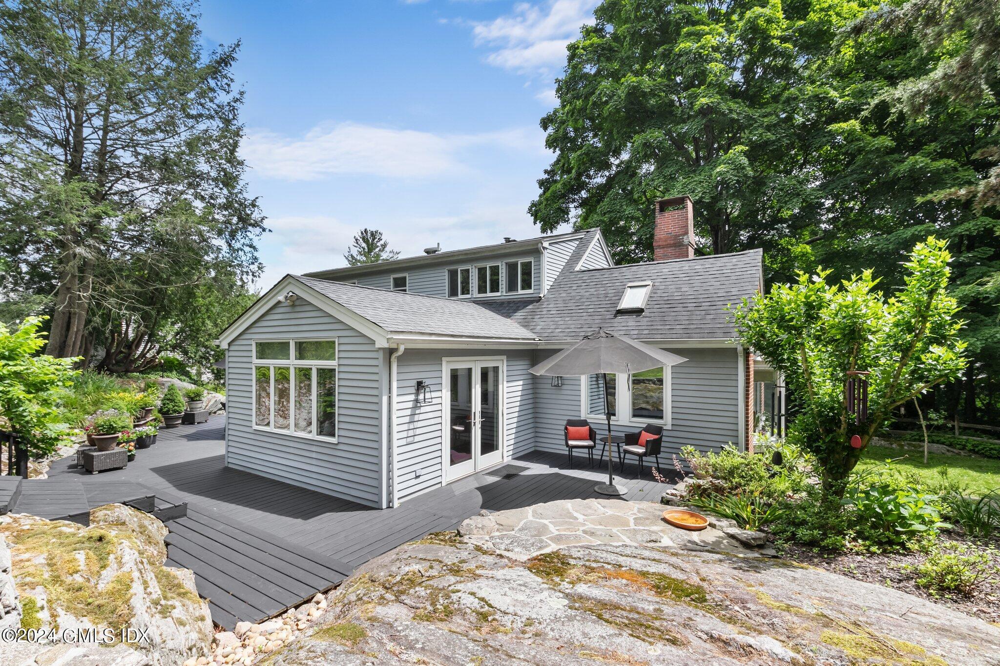 300 Orchard Street Greenwich, CT 06830 - Photo 36 of 40 a view of a house with a patio