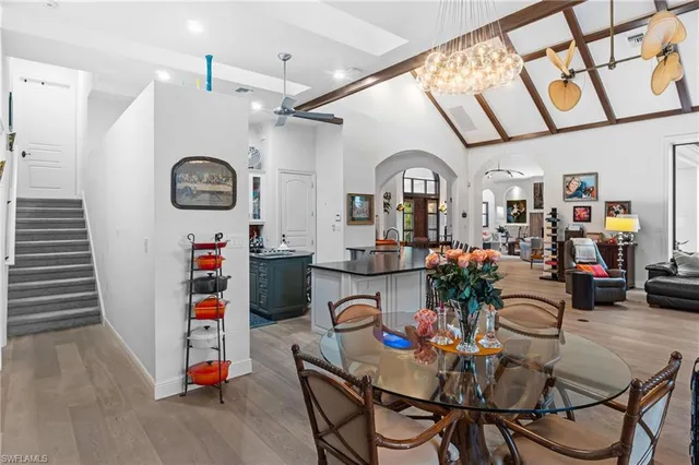 a living room with furniture and kitchen view