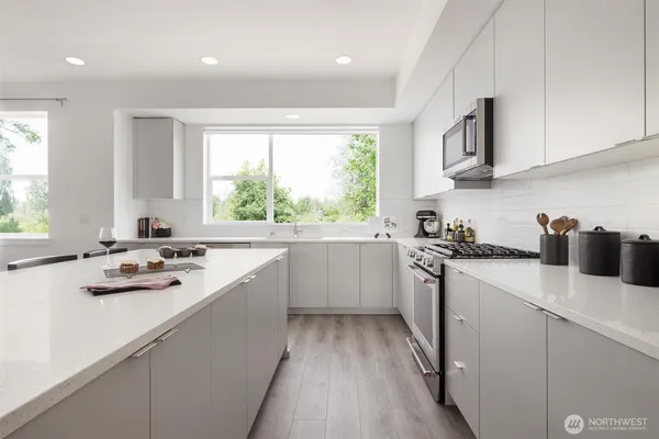 a view of a dining room with furniture and a chandelier
