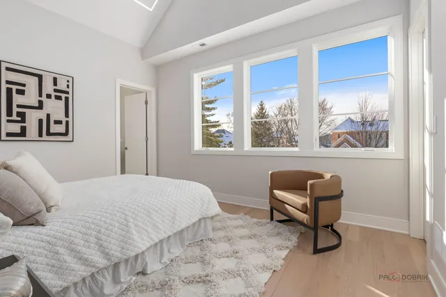 a bathroom with a granite countertop sink a toilet and a mirror