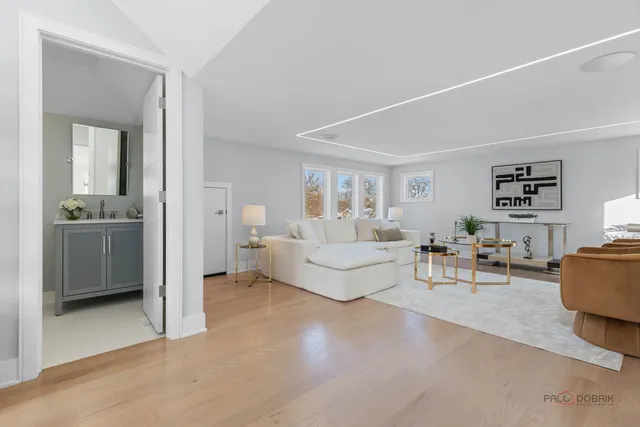 a spacious bathroom with a double vanity sink toilet and shower