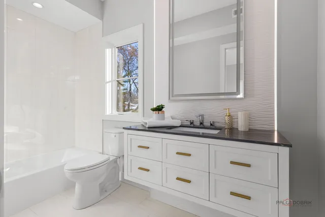 a view of a livingroom with wooden floor and stairs