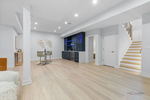 a large room with lots of white furniture