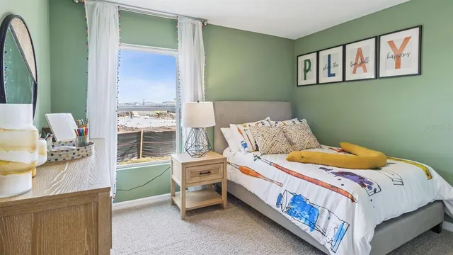 a bedroom with a bed and a dresser