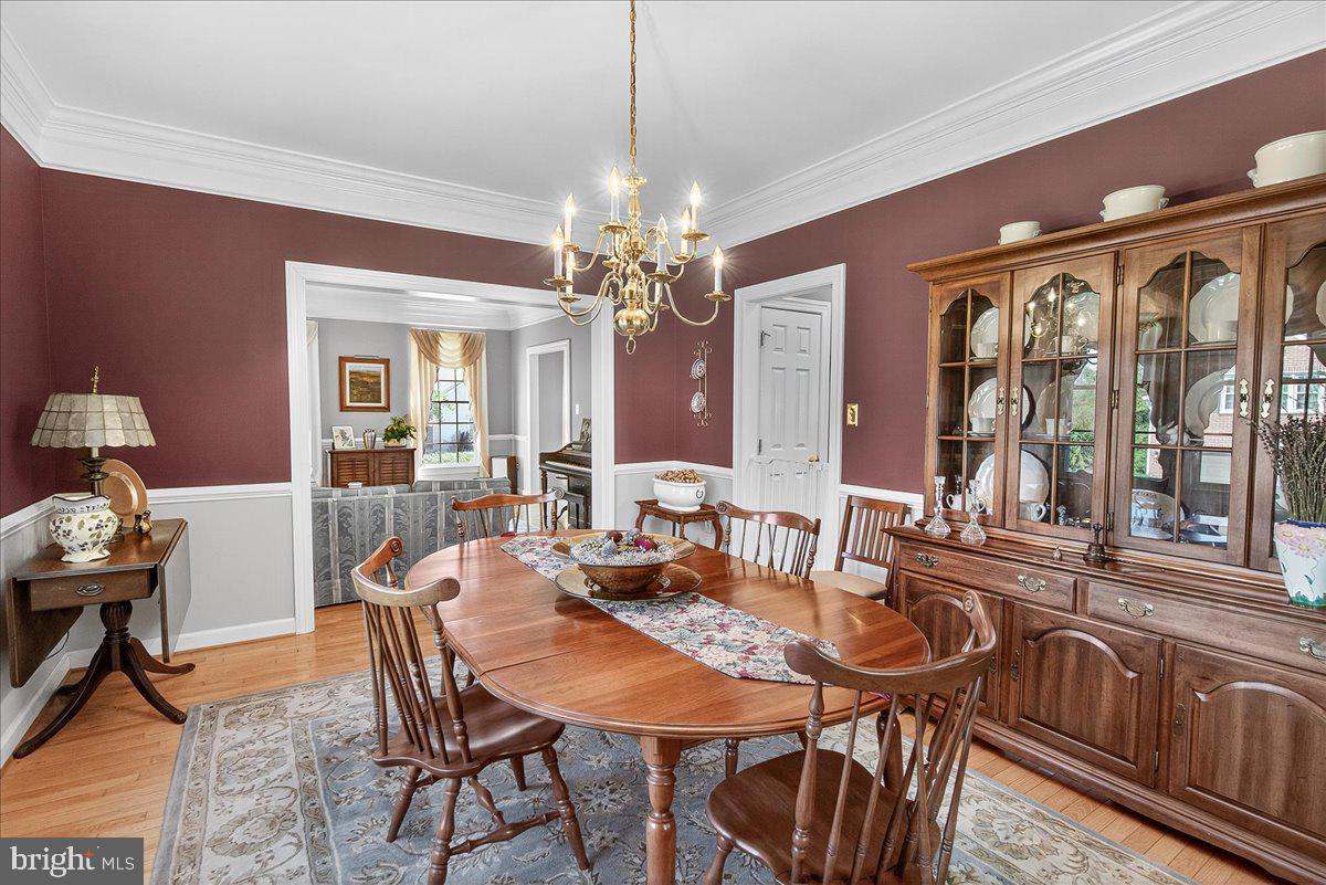 7010 Club House Circle New Market, MD 21774 - Photo 12 of 90 Formal Dining Room w/HW floors and natural light