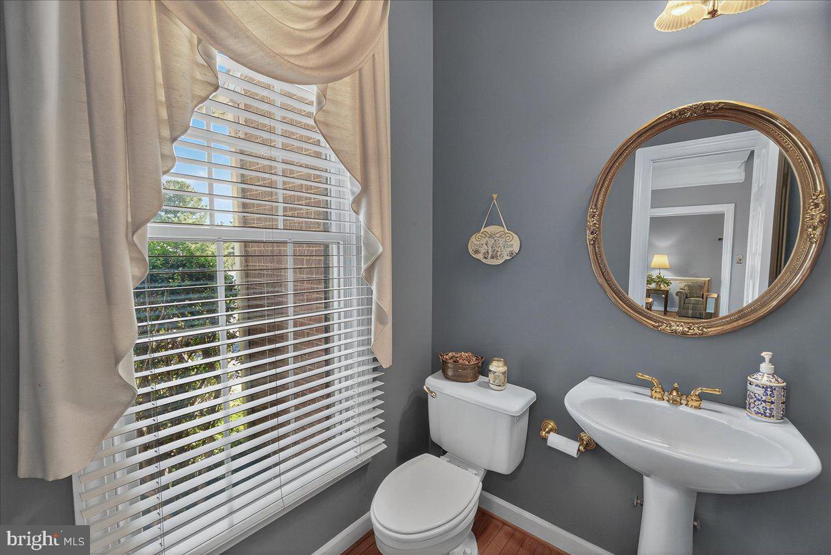 7010 Club House Circle New Market, MD 21774 - Photo 14 of 90 Main level powder room with HW floors