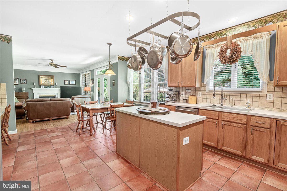 7010 Club House Circle New Market, MD 21774 - Photo 15 of 90 a kitchen with lots of counter top space and dining table