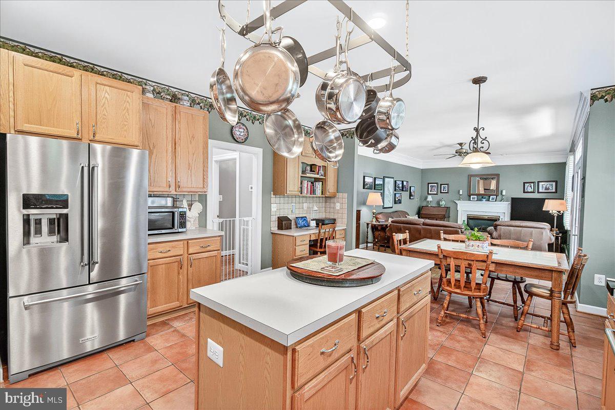 7010 Club House Circle New Market, MD 21774 - Photo 16 of 90 a kitchen with stainless steel appliances granite countertop a sink a stove and a refrigerator