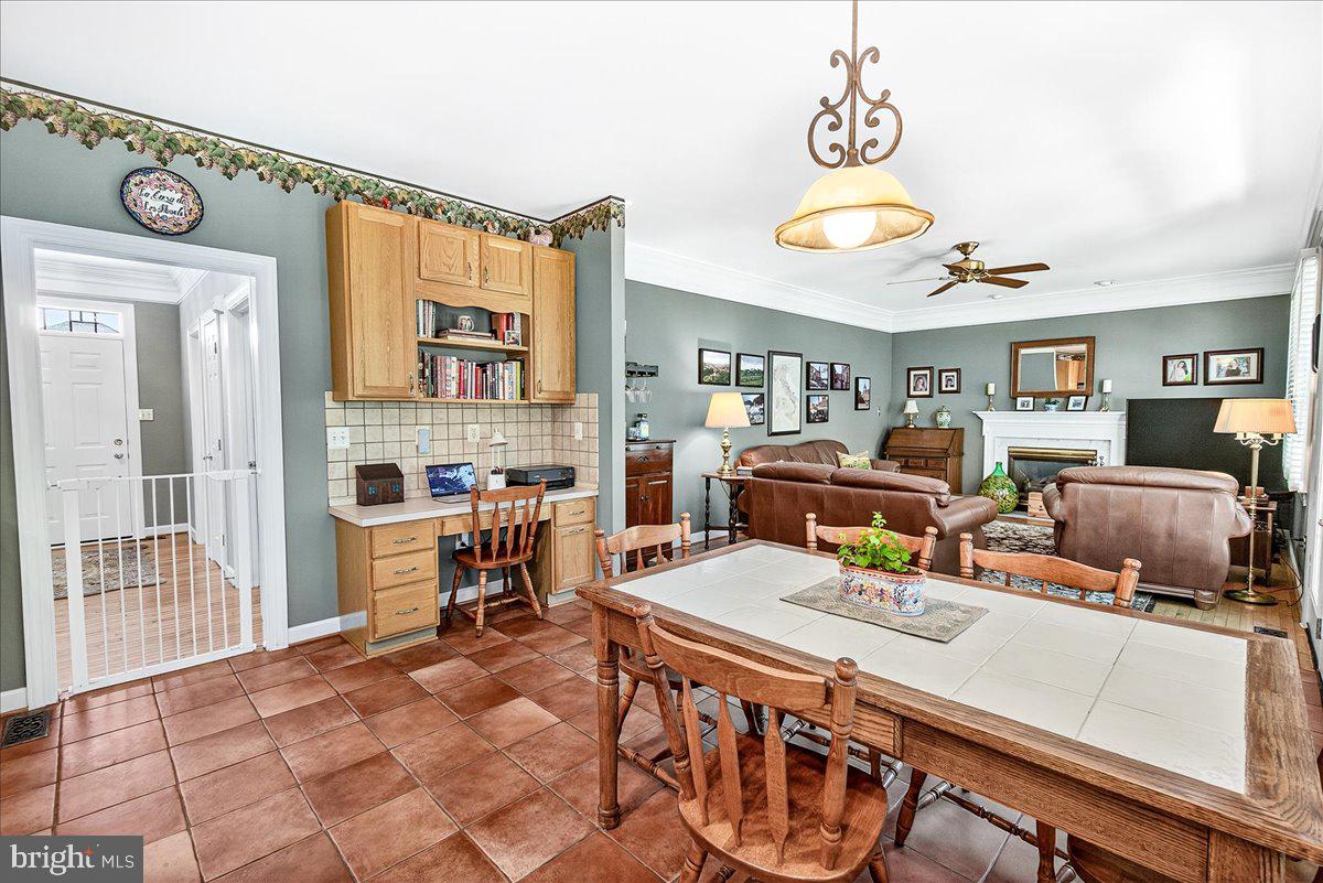 7010 Club House Circle New Market, MD 21774 - Photo 20 of 90 a living room with furniture a window and flat screen tv