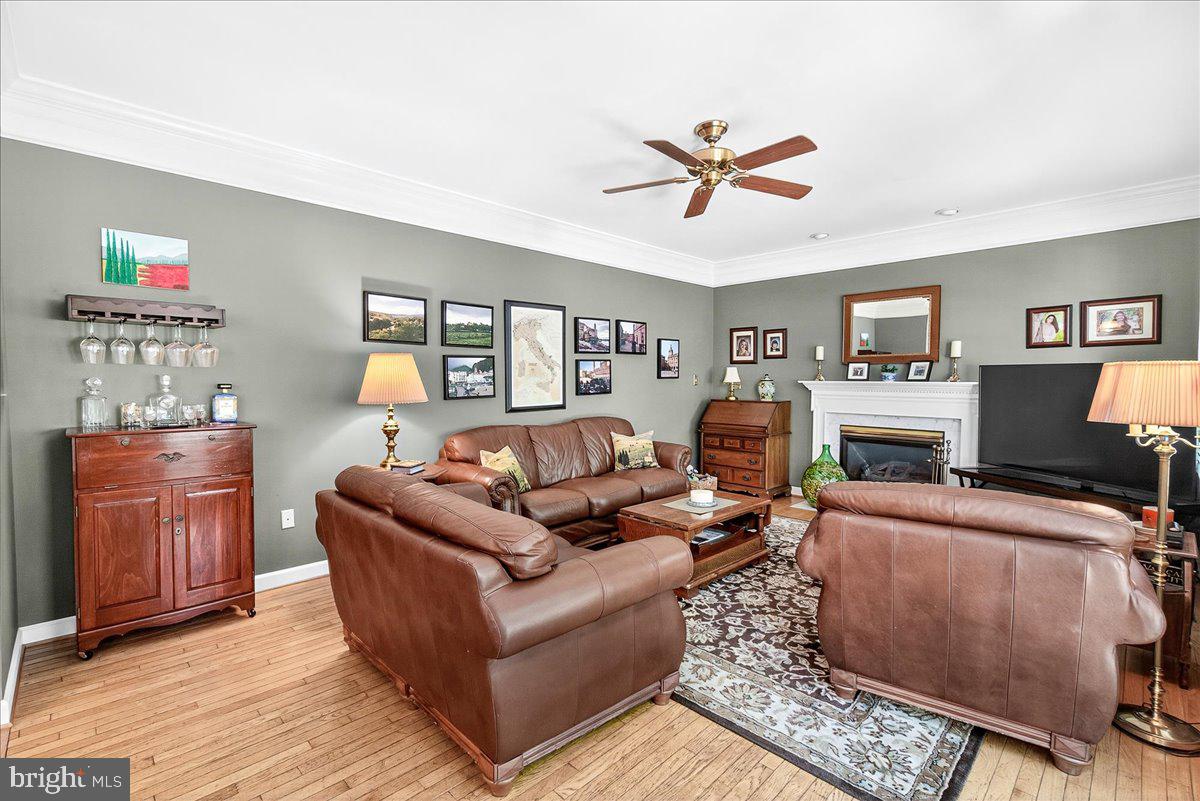 7010 Club House Circle New Market, MD 21774 - Photo 26 of 90 a living room with furniture and a flat screen tv