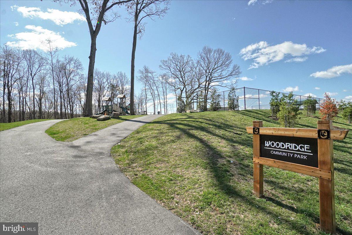7010 Club House Circle New Market, MD 21774 - Photo 67 of 90 a view of a street with a building in the background