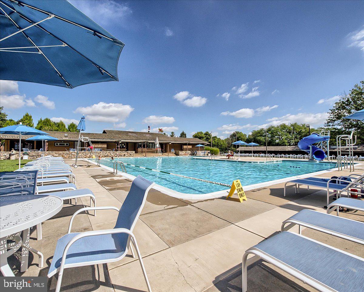 7010 Club House Circle New Market, MD 21774 - Photo 73 of 90 a view of swimming pool with outdoor seating and city view