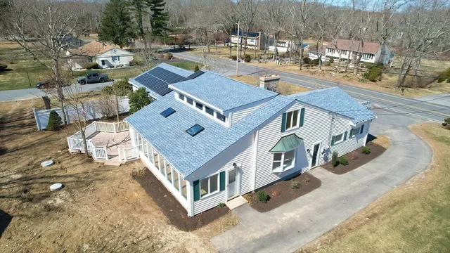 an aerial view of residential houses with outdoor space