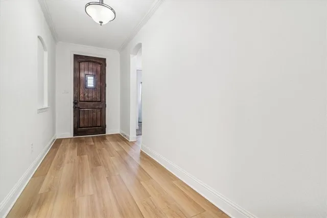 a view of a room with wooden floor and closet