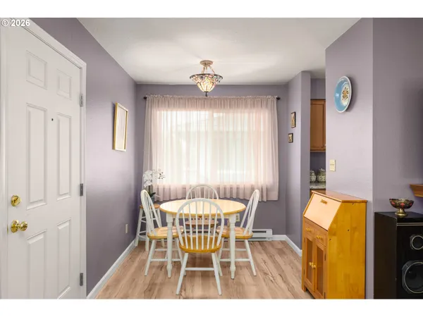 a dining room with furniture and window