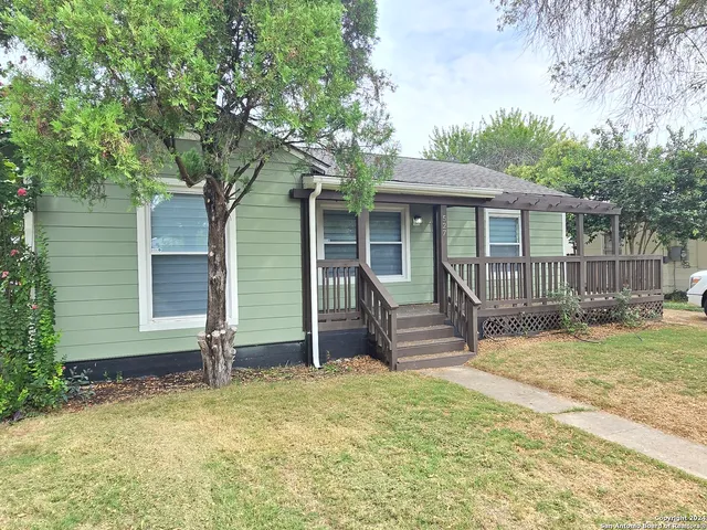 a backyard of a house with seating space
