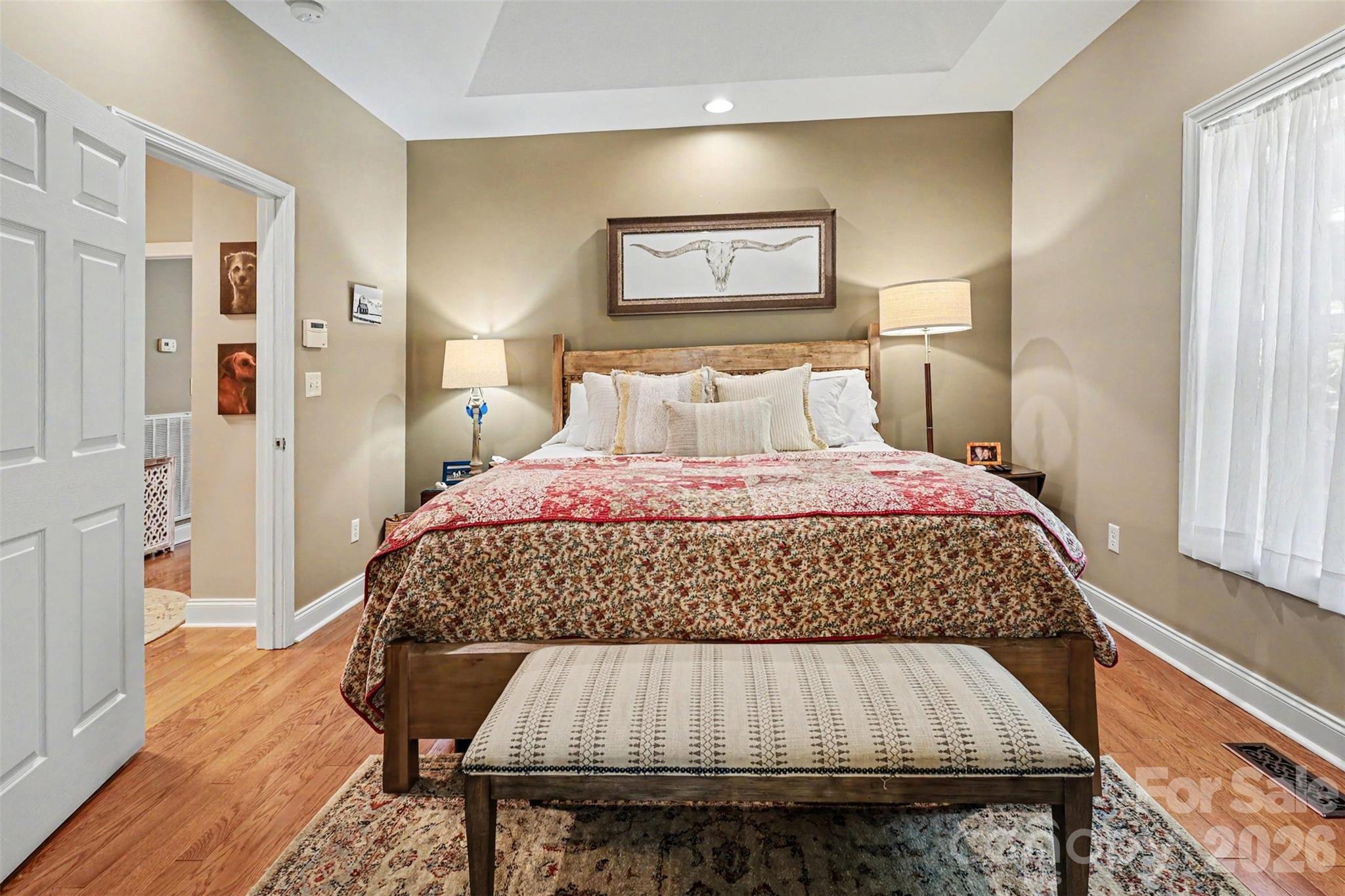4037 Old Williamston Road Belton, SC 29627 - Photo 15 of 41 a bedroom with a bed and wooden floor