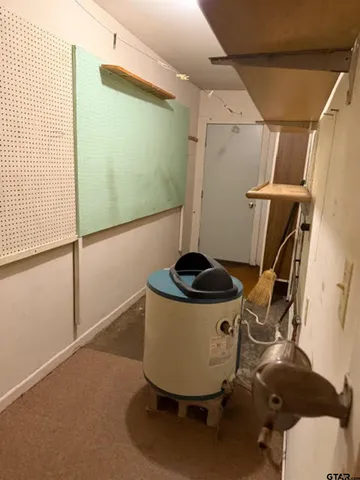 a view of a room with wooden floor and windows