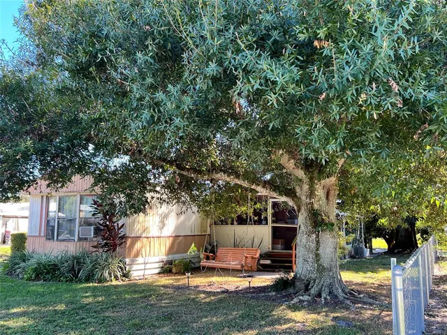 a view of outdoor space with trees all around