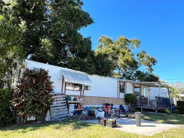 a view of a house with swimming pool in front of it