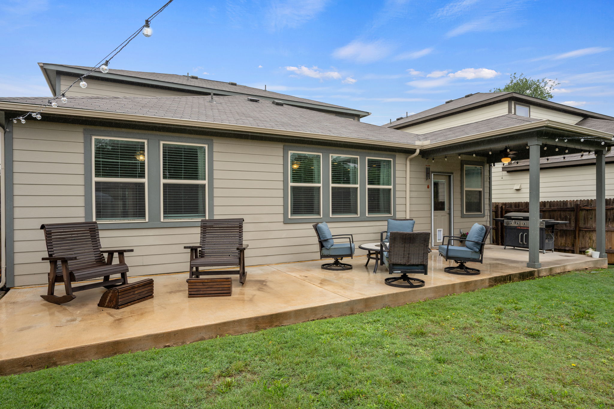 409 Limestone Road Liberty Hill, TX 78642 - Photo 31 of 35 a backyard of a house with table and chairs