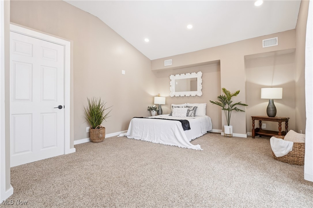 244 Shields Road Youngstown, OH 44512 - Photo 25 of 36 Bedroom featuring vaulted ceiling, light colored carpet, and recessed lighting