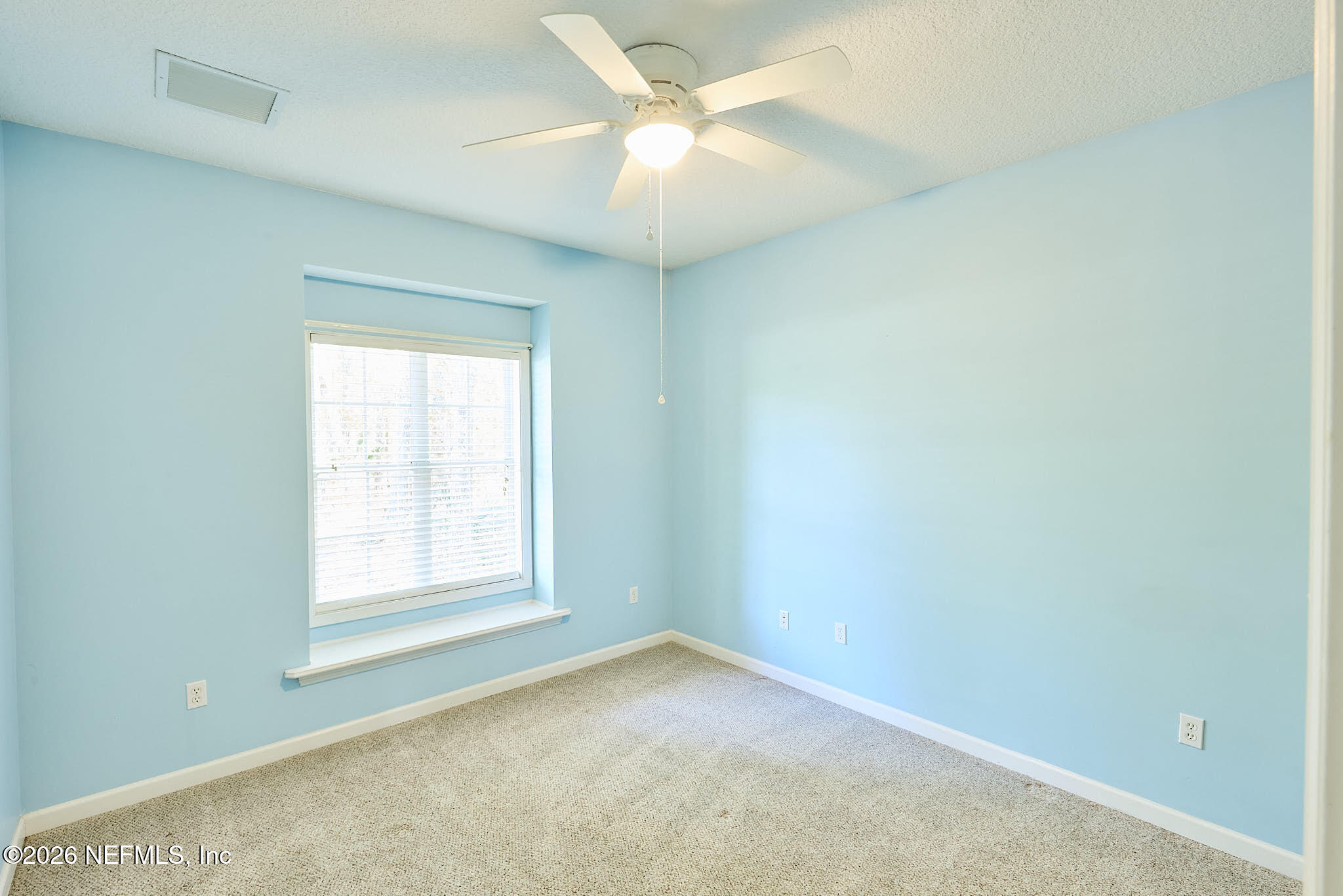 85404 Burmeister Road Fernandina Beach, FL 32034 - Photo 48 of 53 an empty room with a window and a fan
