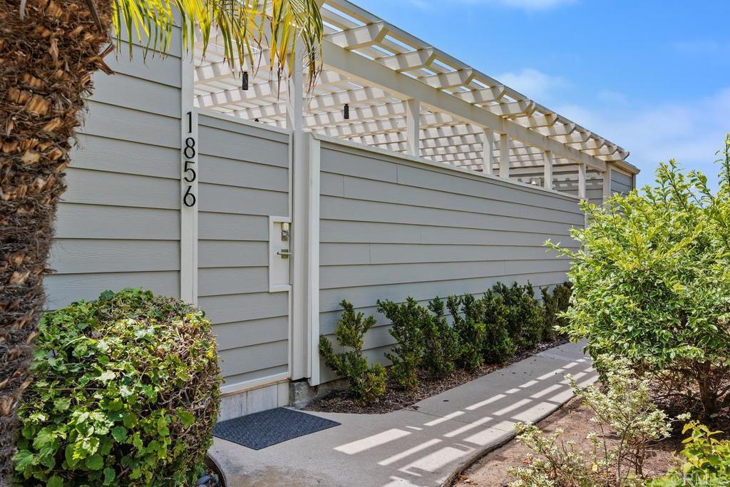 1856 Parliament Road Encinitas, CA 92024 - Photo 5 of 42 a front view of a house with a garden