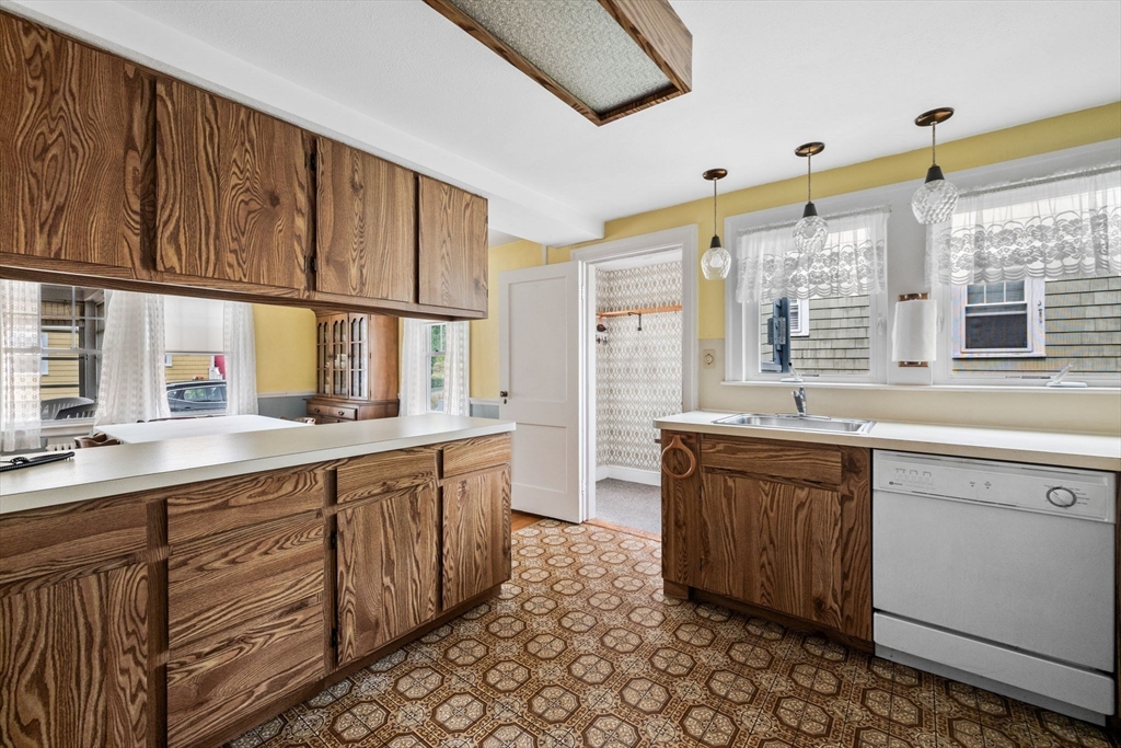 10 Shepard Street Marblehead, MA 01945 - Photo 11 of 42 a large kitchen with stainless steel appliances granite countertop a sink and cabinets