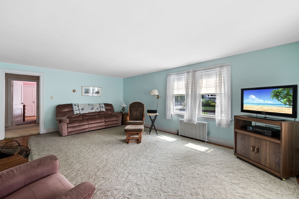 10 Shepard Street Marblehead, MA 01945 - Photo 16 of 42 a bedroom with furniture and a flat screen tv