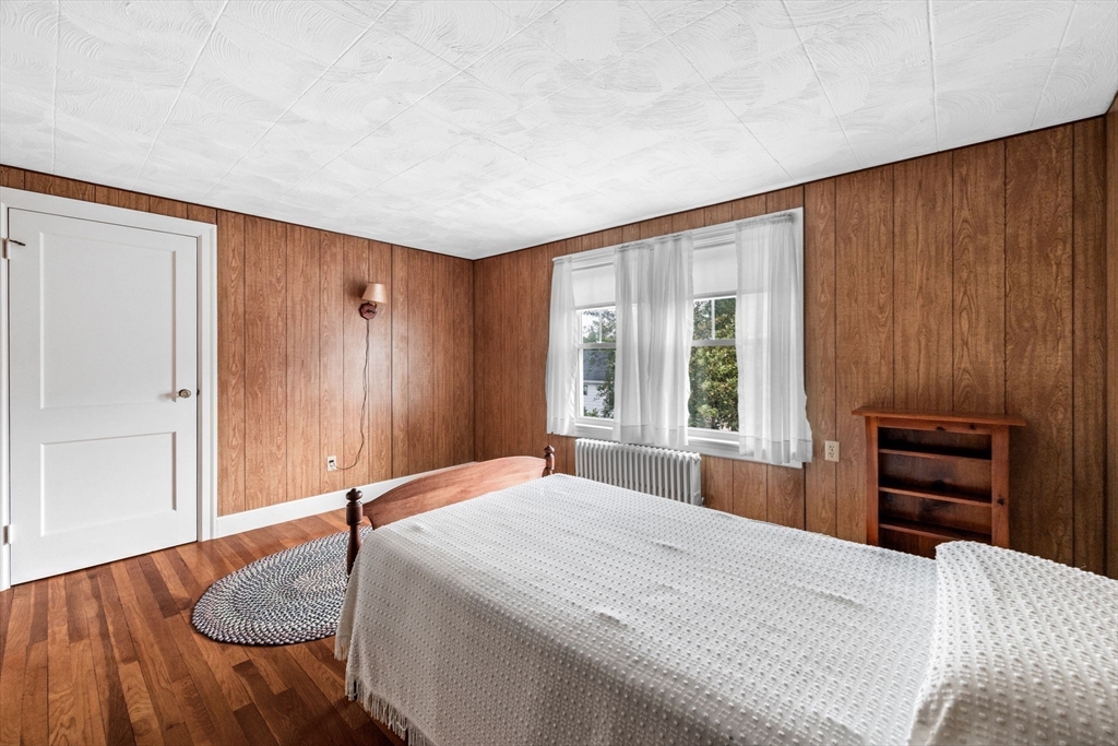 10 Shepard Street Marblehead, MA 01945 - Photo 27 of 42 a bedroom with a bed and a dresser