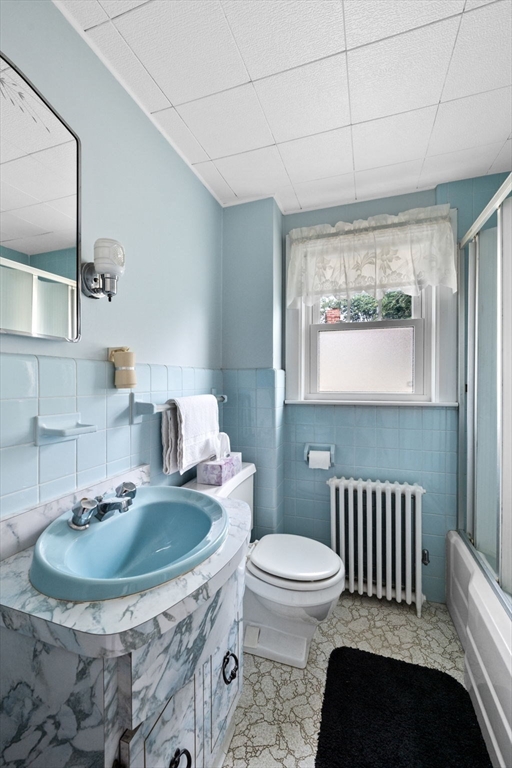 10 Shepard Street Marblehead, MA 01945 - Photo 28 of 42 a bathroom with a sink a toilet and a mirror