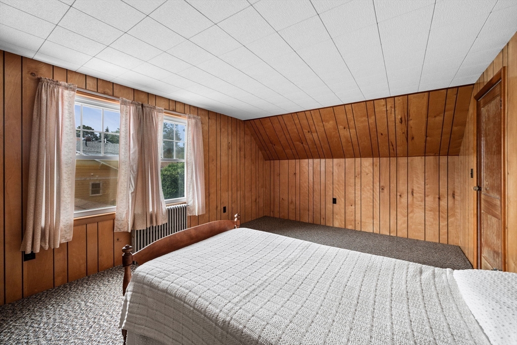 10 Shepard Street Marblehead, MA 01945 - Photo 33 of 42 a view of a bedroom with wooden floor and furniture