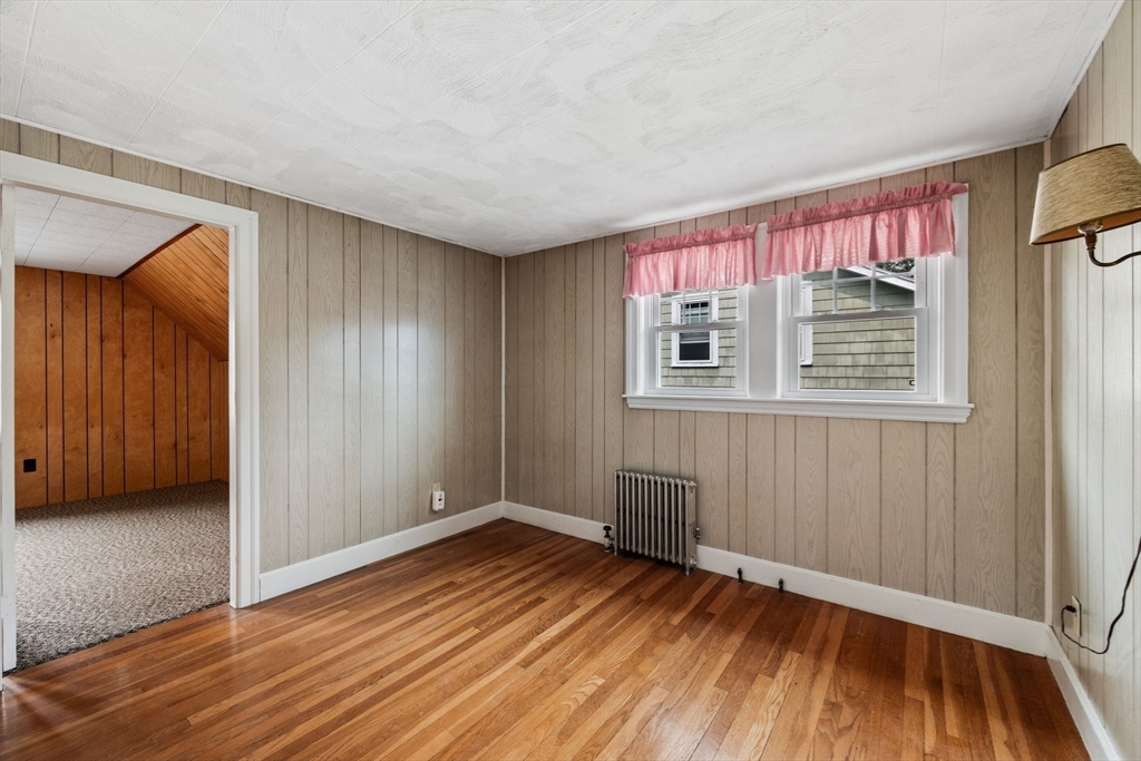 10 Shepard Street Marblehead, MA 01945 - Photo 35 of 42 a view of an empty room with wooden floor and a window