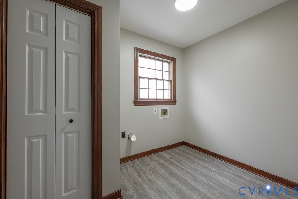11030 Golden Leaf Road Chester, VA 23831 - Photo 14 of 50 Laundry room featuring light wood-style floors and