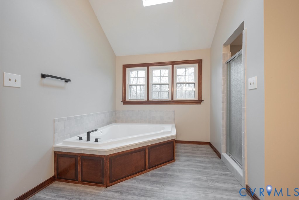 11030 Golden Leaf Road Chester, VA 23831 - Photo 29 of 50 Full bathroom with lofted ceiling, a shower stall,