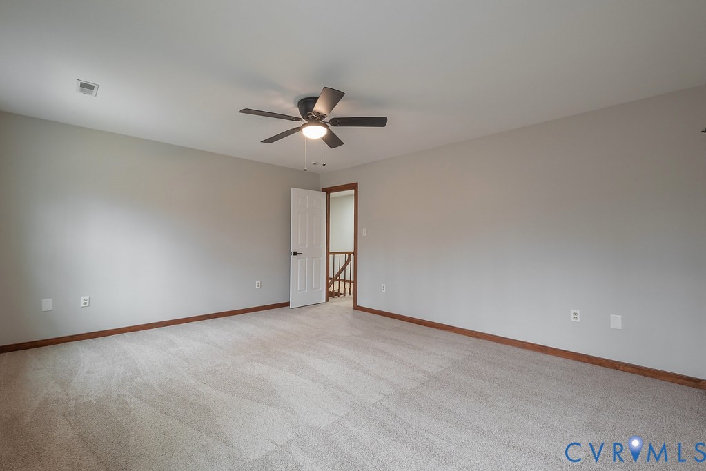 11030 Golden Leaf Road Chester, VA 23831 - Photo 32 of 50 Spare room with light carpet and ceiling fan