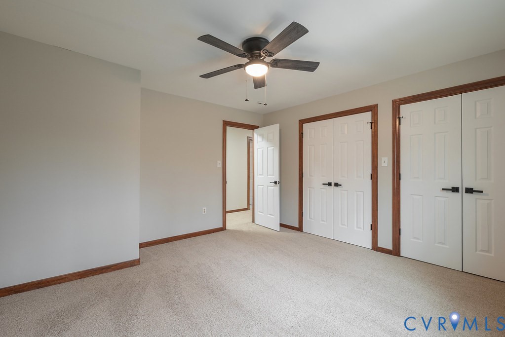 11030 Golden Leaf Road Chester, VA 23831 - Photo 34 of 50 Unfurnished bedroom with two closets, light carpet