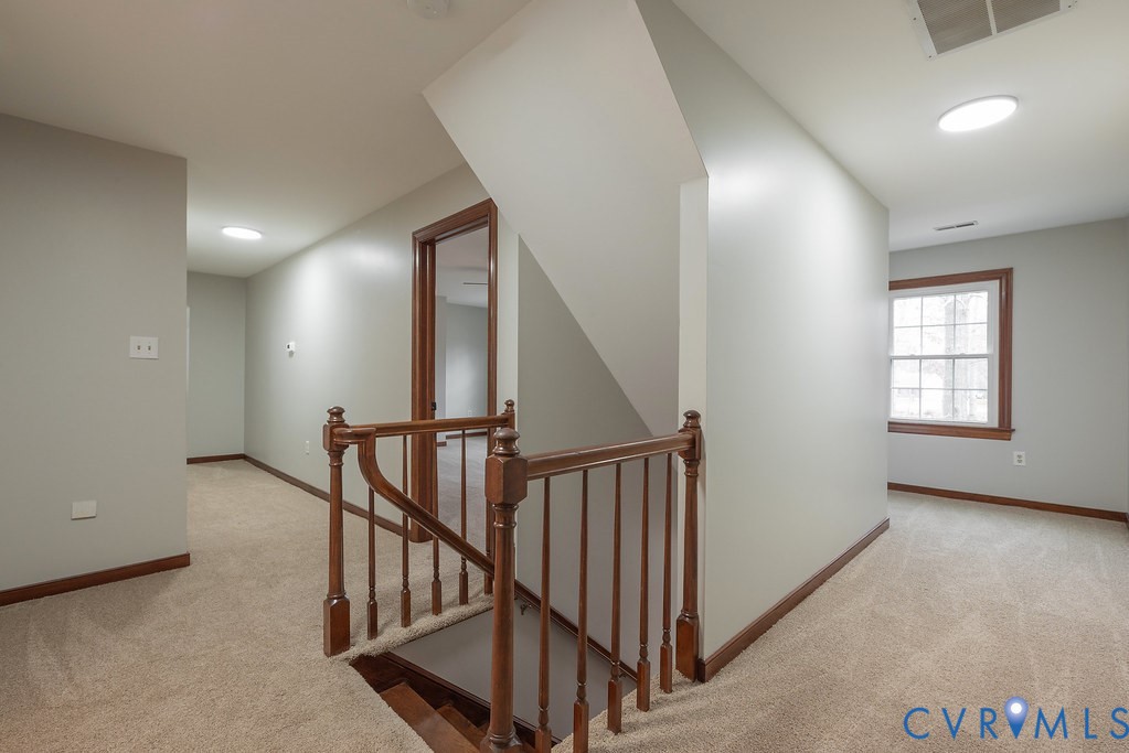 11030 Golden Leaf Road Chester, VA 23831 - Photo 39 of 50 Hall with an upstairs landing and light colored ca