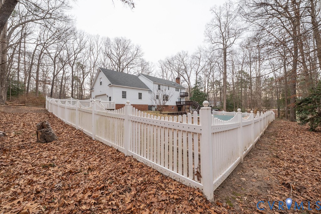 11030 Golden Leaf Road Chester, VA 23831 - Photo 50 of 50 Rear view of house with a chimney, a fenced backya