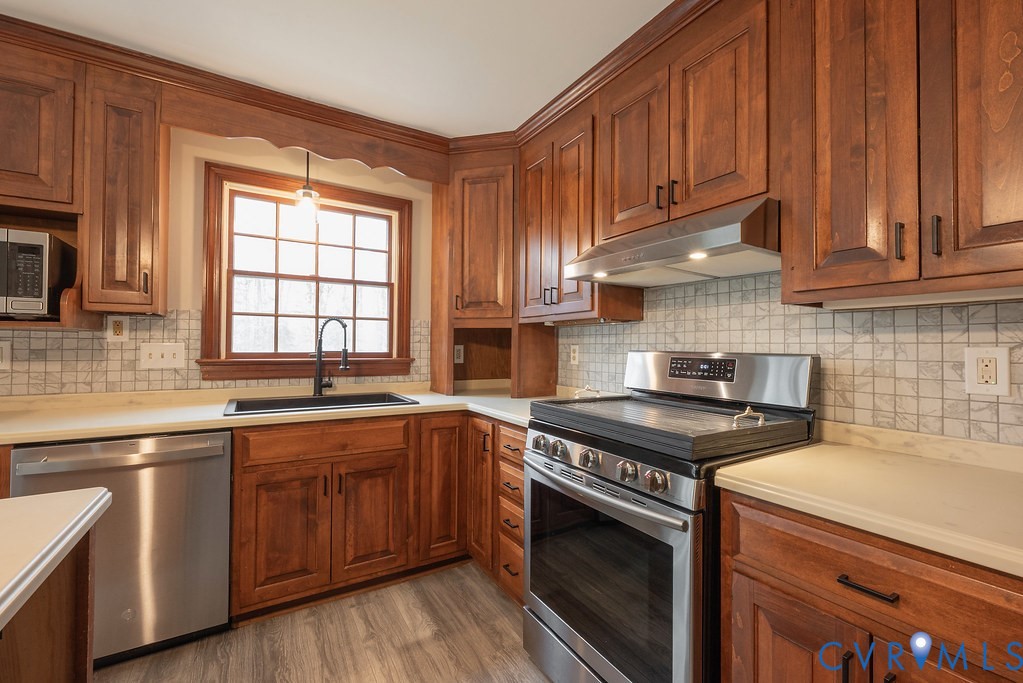 Kitchen with appliances with stainless steel finis