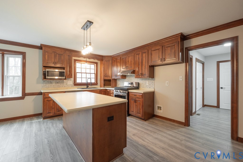 11030 Golden Leaf Road Chester, VA 23831 - Photo 8 of 50 Kitchen featuring brown cabinetry, light counterto