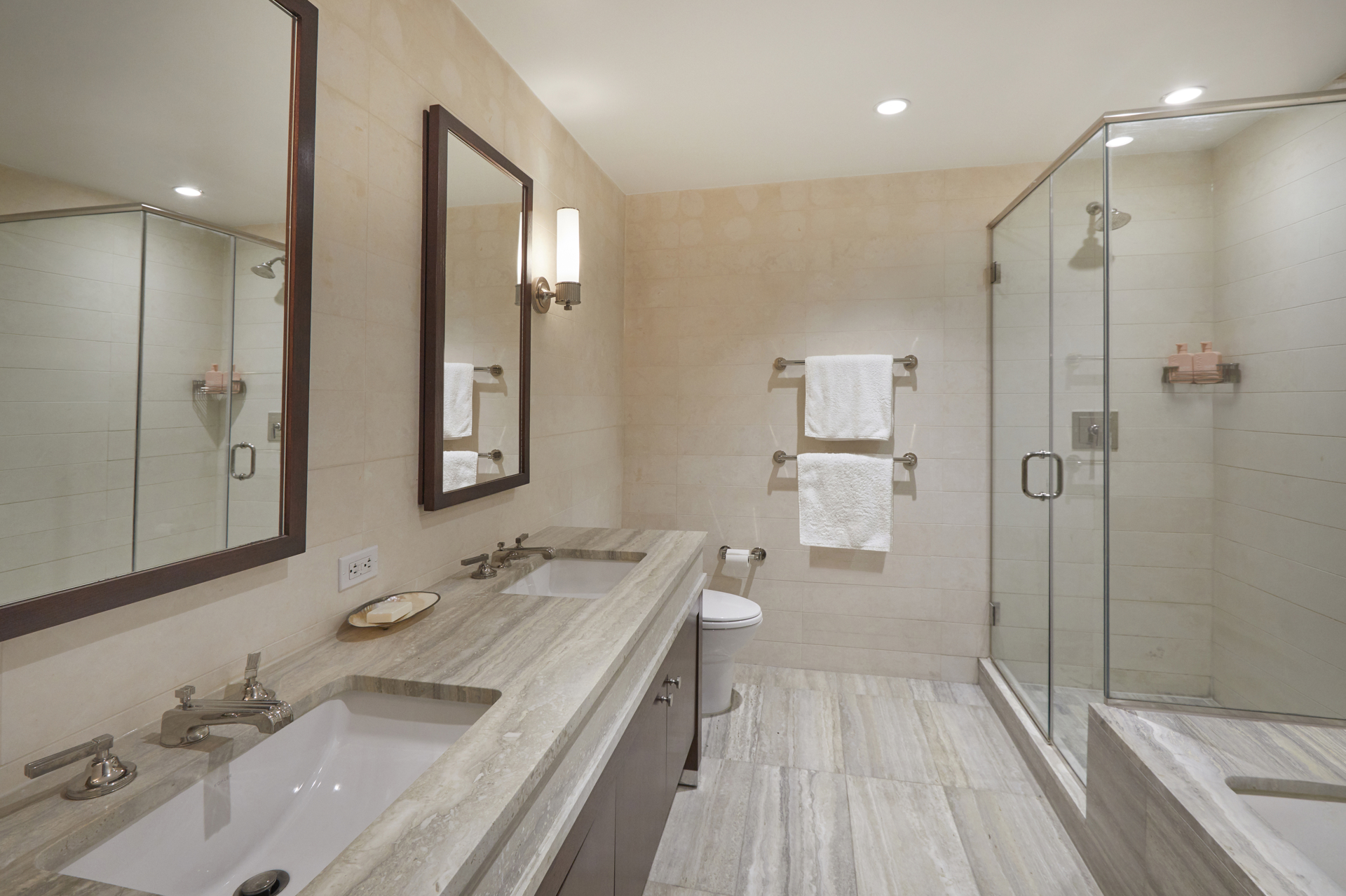 80 Riverside Boulevard, Unit 19B Manhattan, NY 10069 - Photo 9 of 18 a bathroom with a bathtub a sink and a mirror