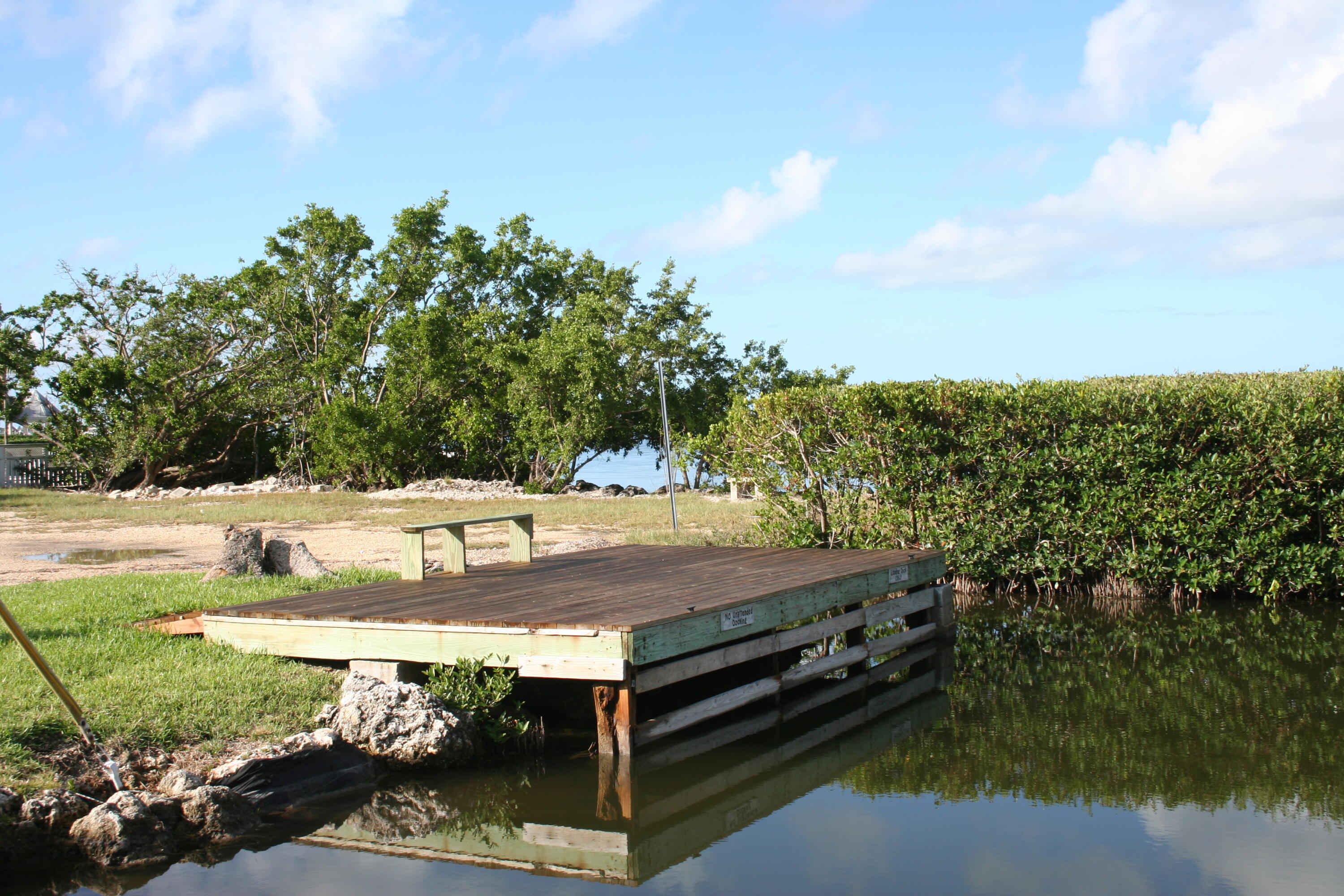 8 Bowen Drive Key Largo, FL 33037 - Photo 20 of 27 a view of a yard with an outdoor space
