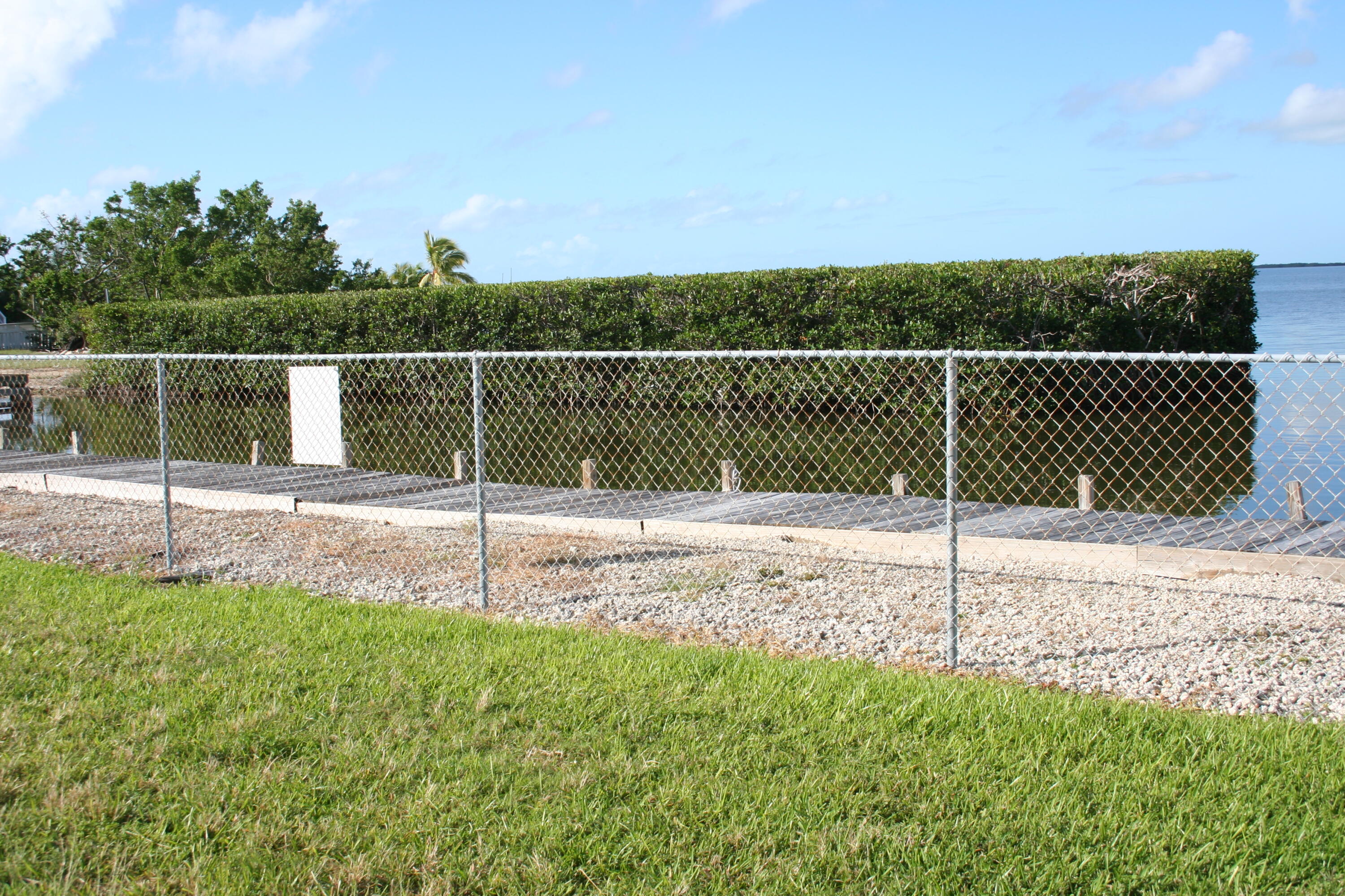 8 Bowen Drive Key Largo, FL 33037 - Photo 26 of 27 a view of a backyard with fence
