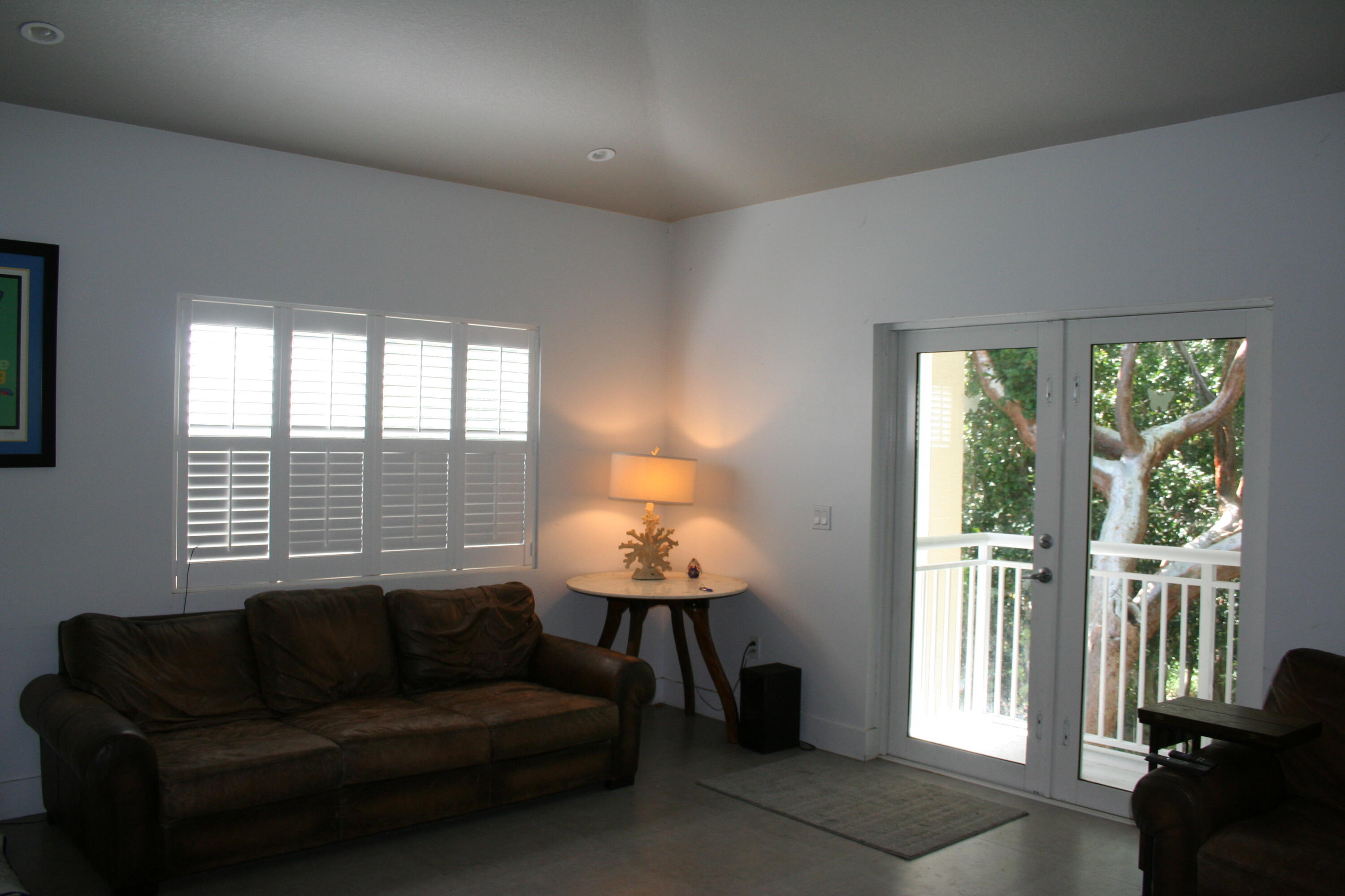 8 Bowen Drive Key Largo, FL 33037 - Photo 5 of 27 a living room with furniture and a window
