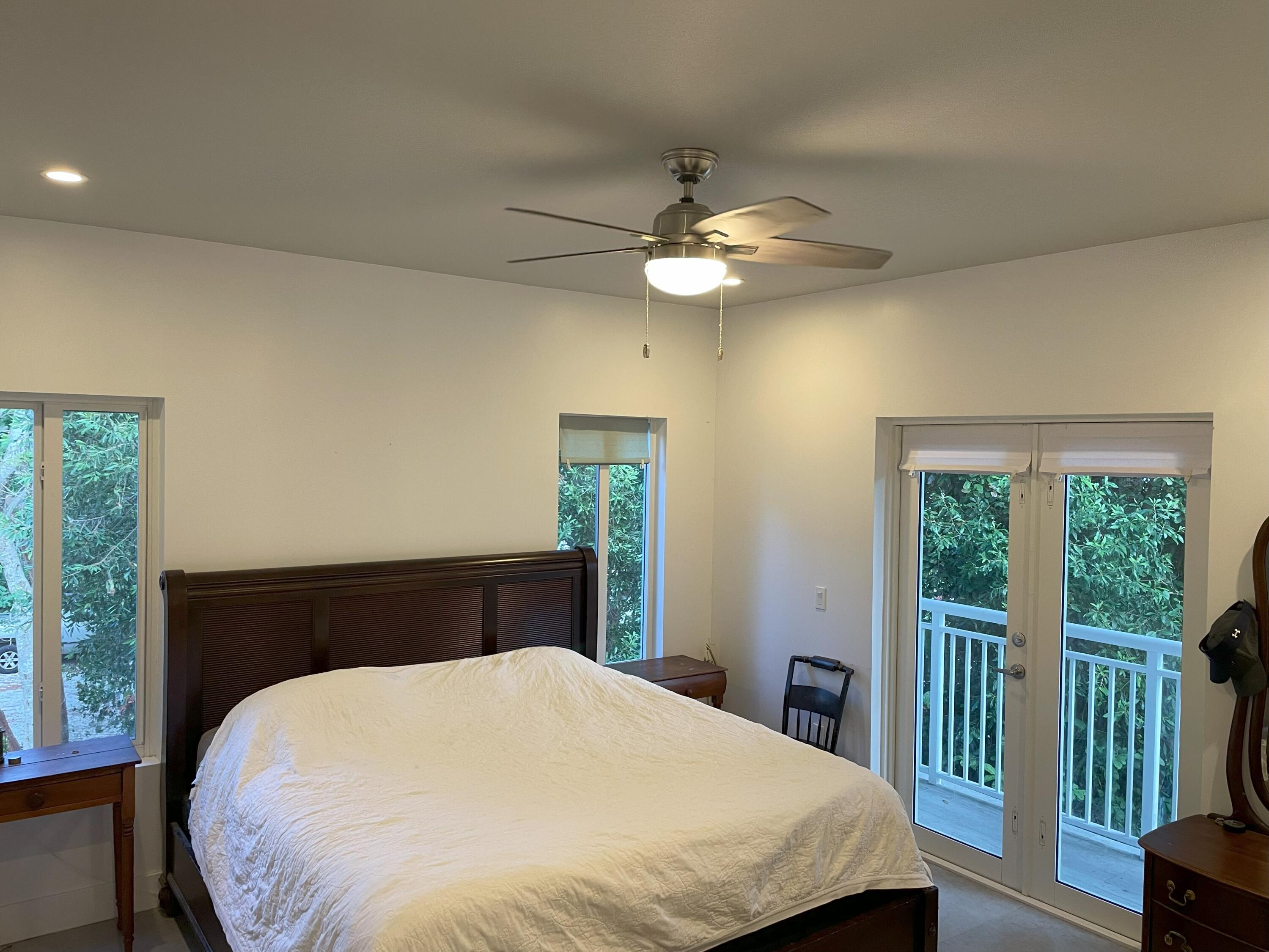 8 Bowen Drive Key Largo, FL 33037 - Photo 8 of 27 a bedroom with a large bed and a large window