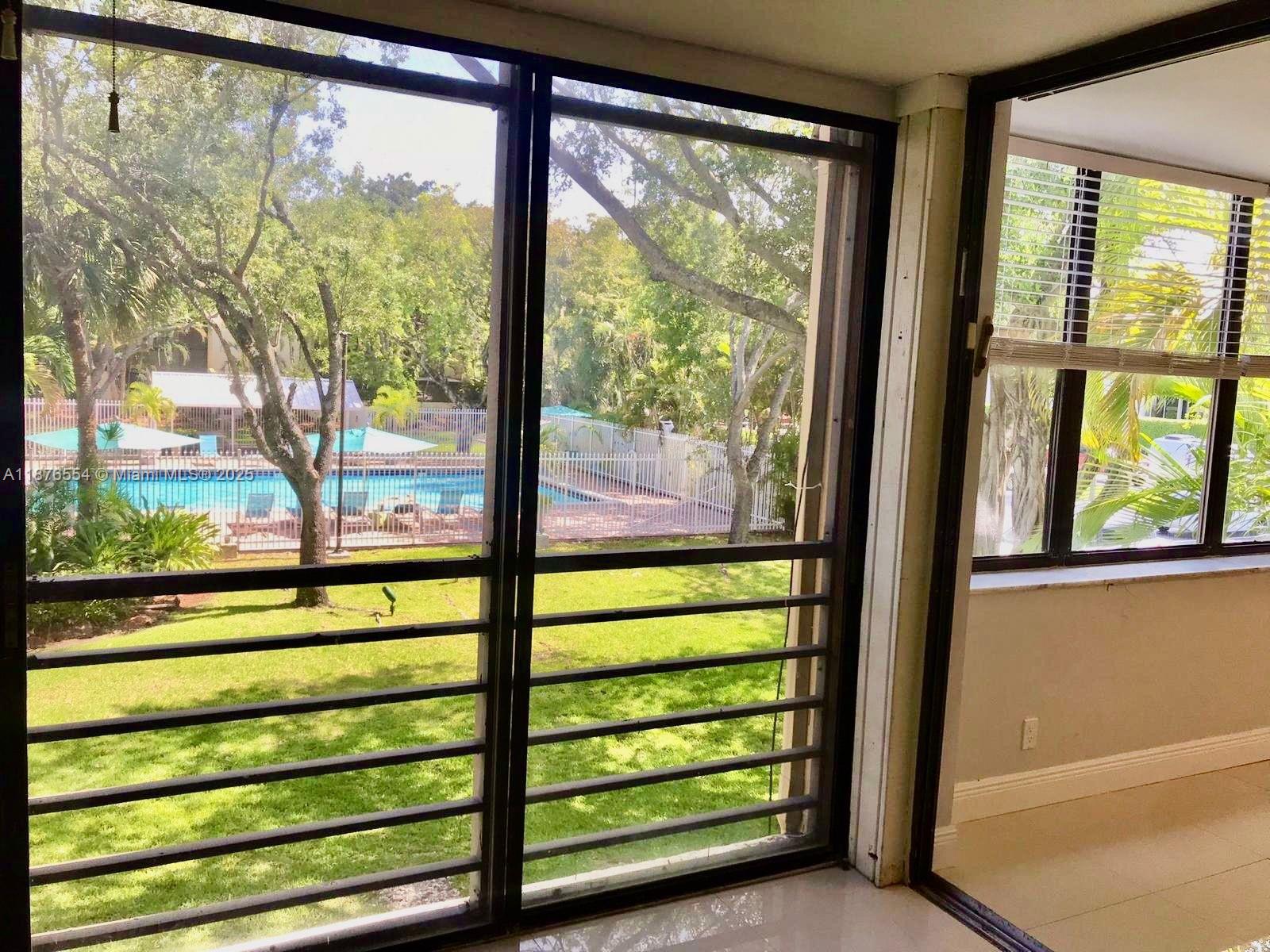 20381 Northeast 30th Avenue, Unit 2067 Aventura, FL 33180 - Photo 11 of 17 a view of a large window with an outdoor view