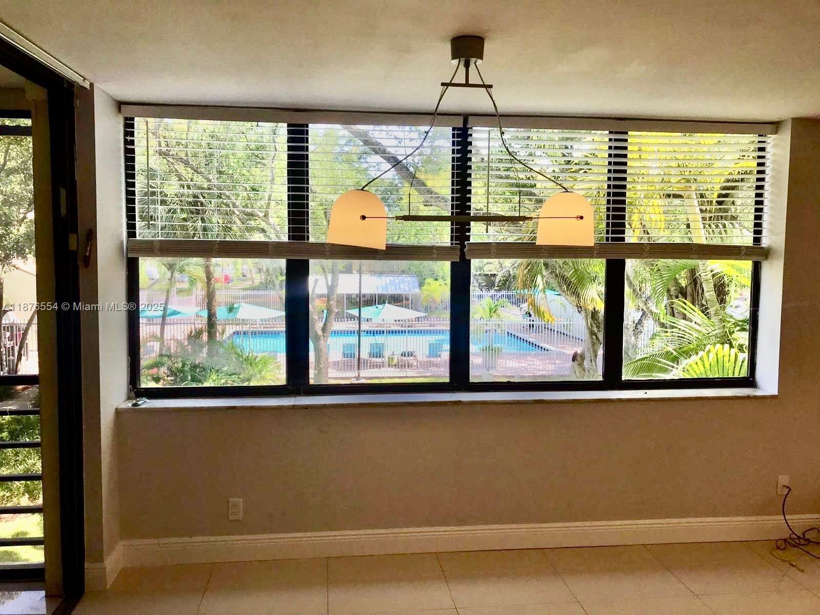 20381 Northeast 30th Avenue, Unit 2067 Aventura, FL 33180 - Photo 10 of 17 a view of a room with a large window
