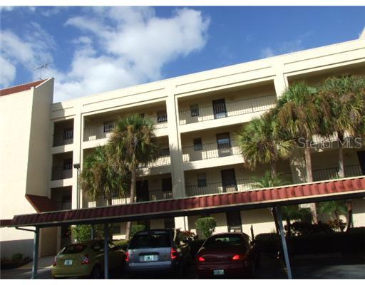 11485 Oakhurst Road, Unit B305 Largo, FL 33774 - Photo 1 of 1 Exterior Front - Covered Parking and condo is on 3rd floor